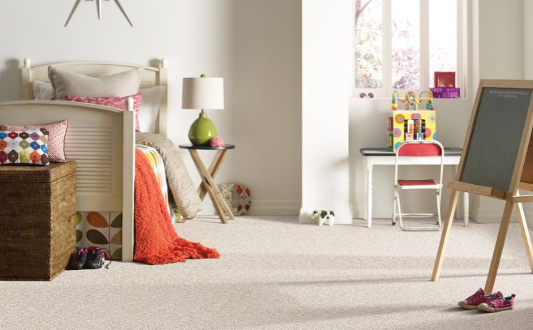 child's bedroom with beige carpet